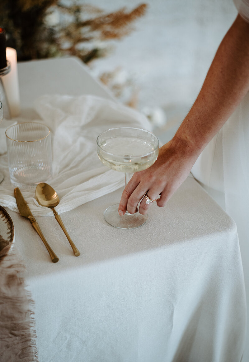 wedding table setting with champagne coupe