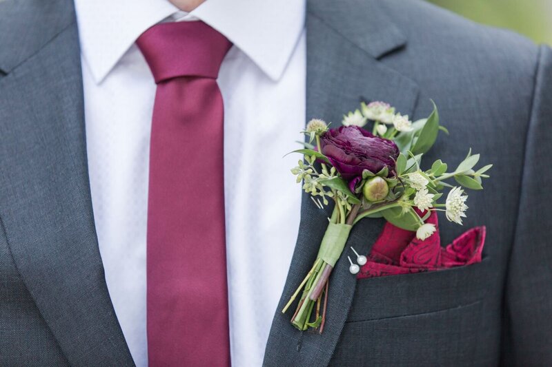 michigan wedding photographer brighton groom flowers