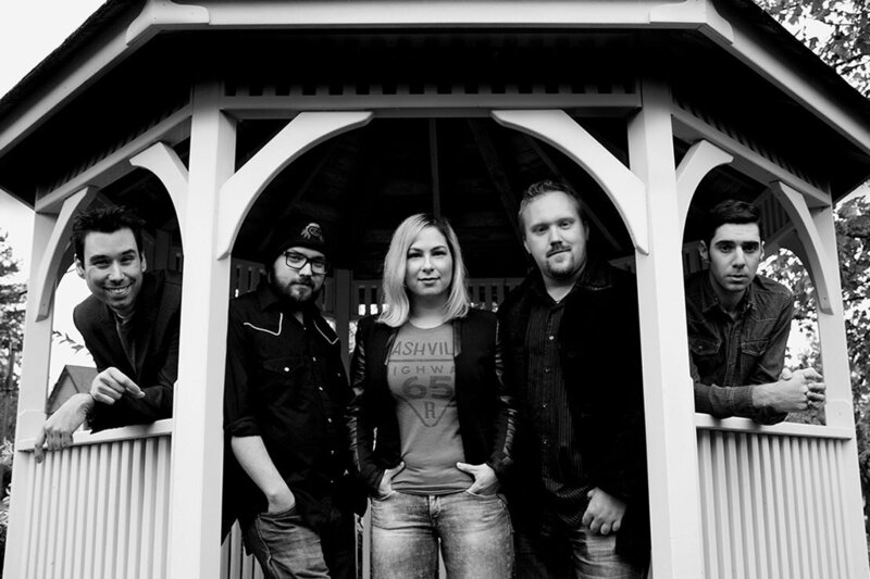 Band photo black and white The FAith Numade Band standing in gazebo