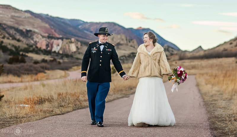 Couple walks along the wide sidewalk at Garden of the Gods in Colorado Springs