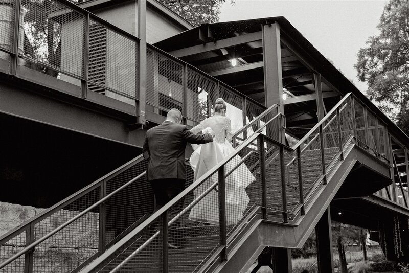 Bride and Groom on staircase at Hotel Emma by Lois M Photography