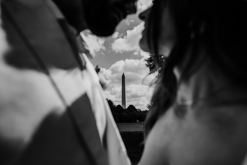 Washington DC Wedding Photographer captures monument between couple.