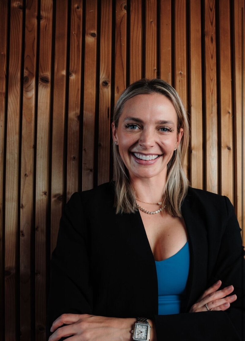 Image of personal fitness trainer sitting on road