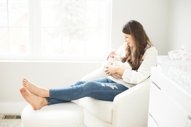 Ann Arbor Newborn Photographer takes light and airy nursery shot with baby girl