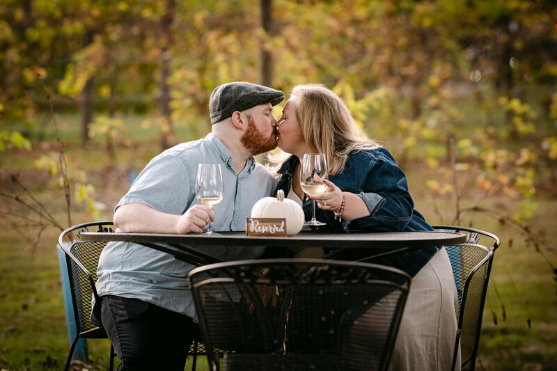 Couple laughing together during their engagement session in New England.