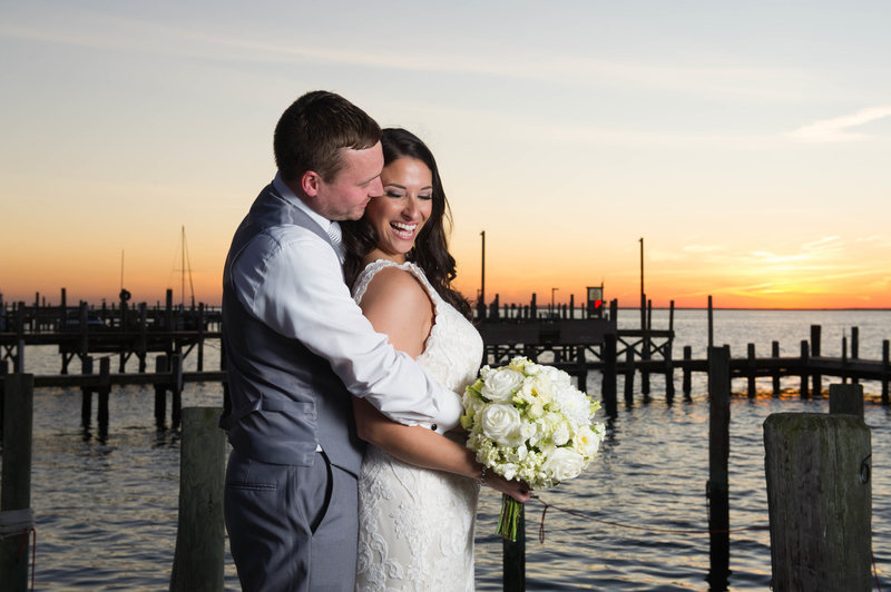 bride and groom laugh at sunset at parkers garage