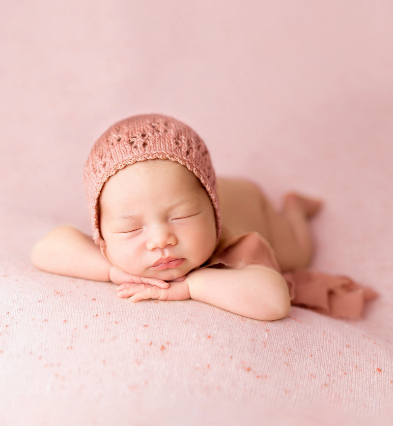 Newborn Baby on Pink Blanket