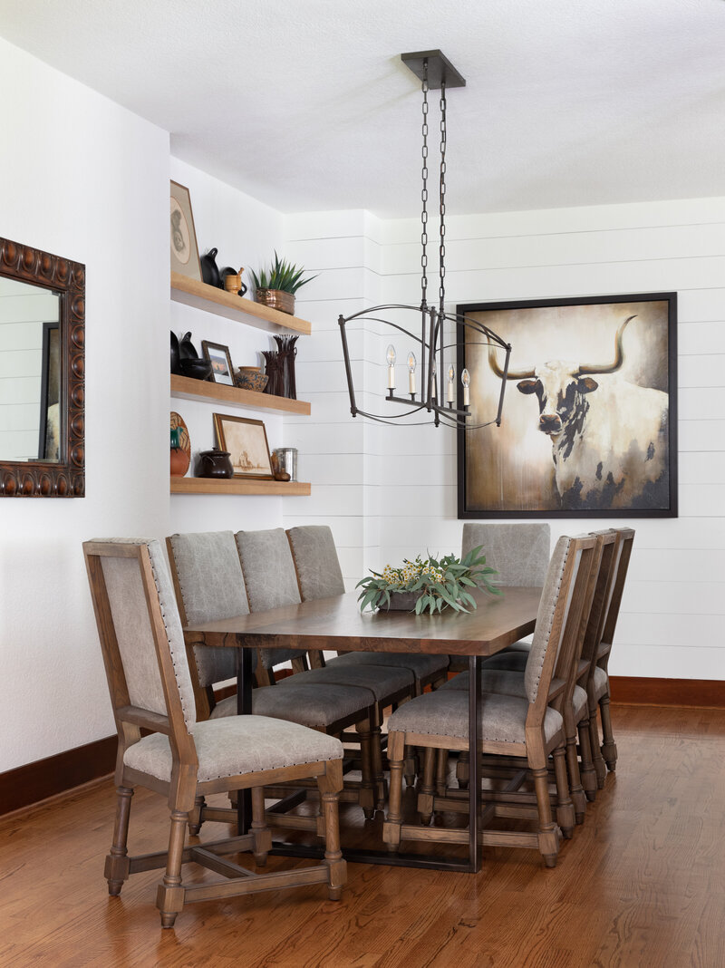 Hill Country Modern aesthetic dining room with longhorn cattle art
