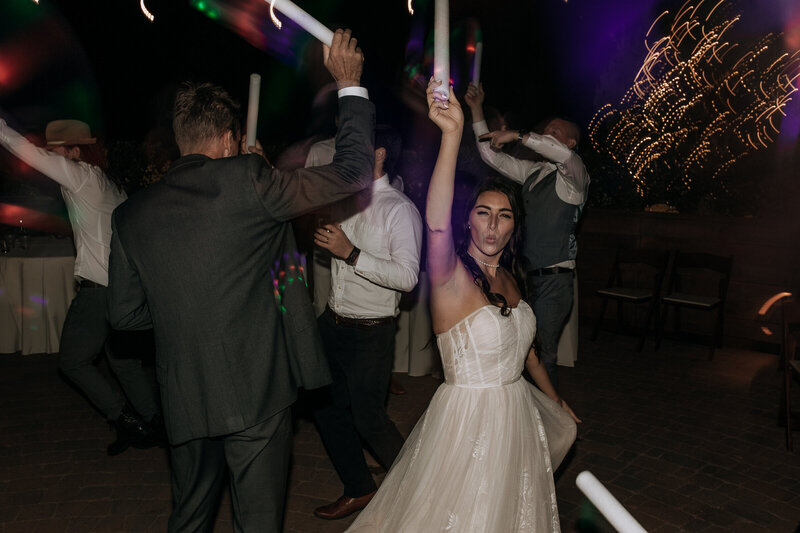 bride celebrating and dancing in dress