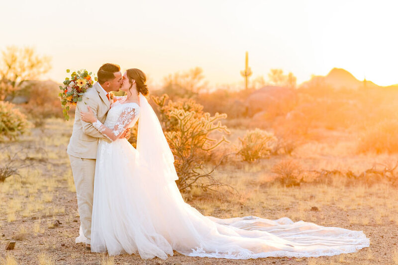 Bride and Groom Kissing in the Desert