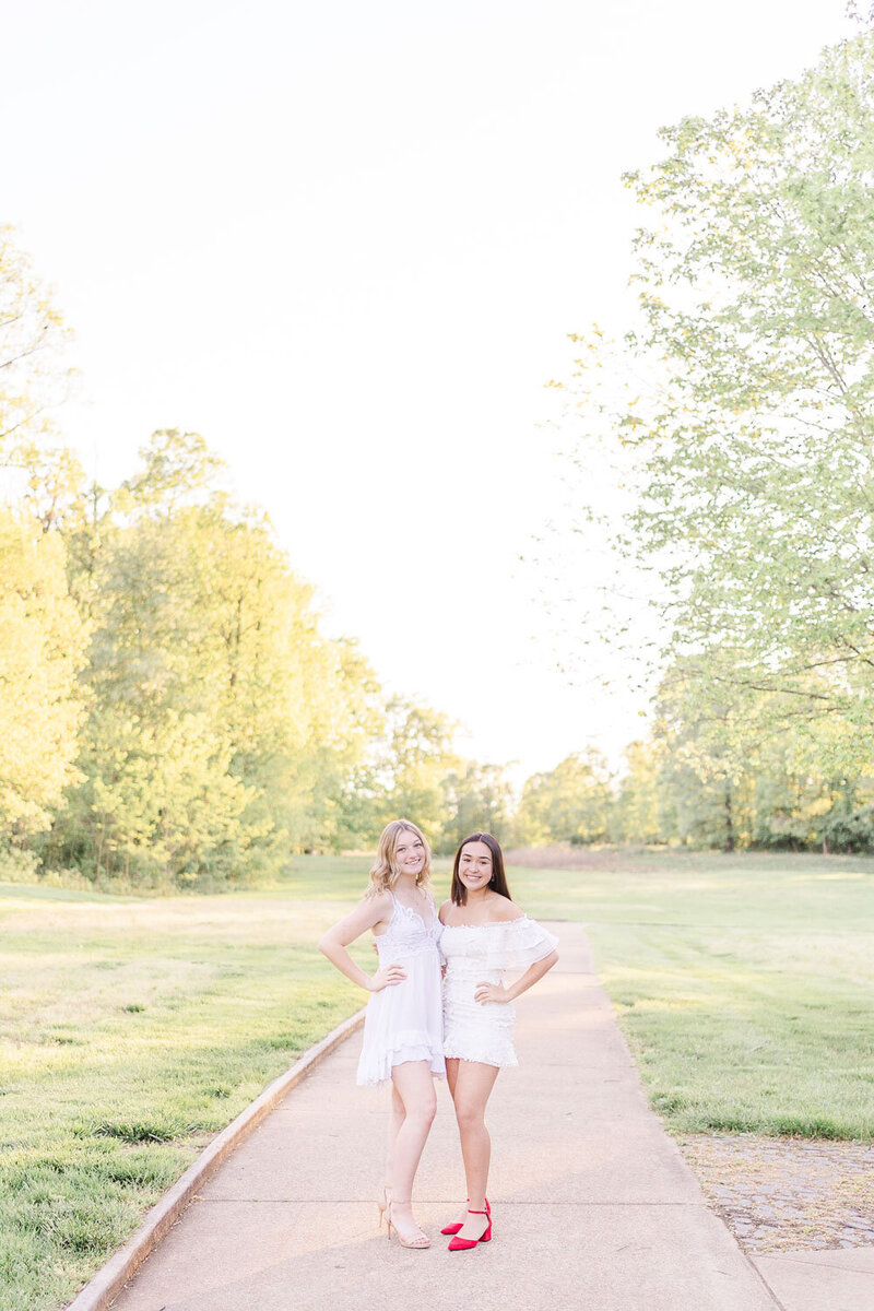 high school best friends looking at the camera smiling taken by Loudoun County, Virginia senior photographer