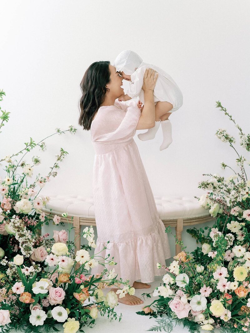Mother and Child happy amongst flowers with Seattle family photographer Jacqueline Benet