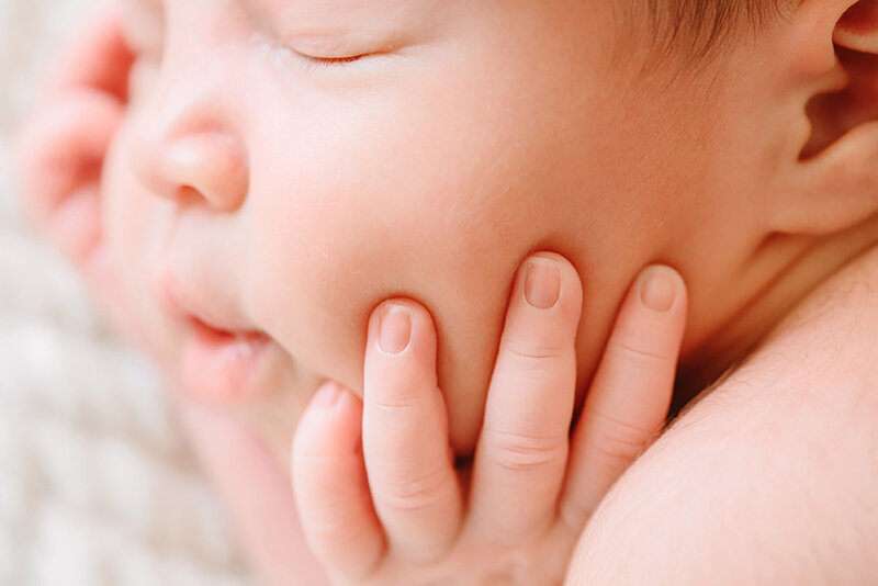 Close up image of a newborn baby's finers.