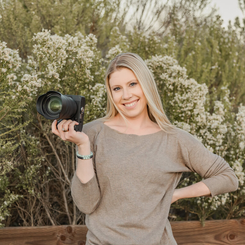 elopement photographer holding camera