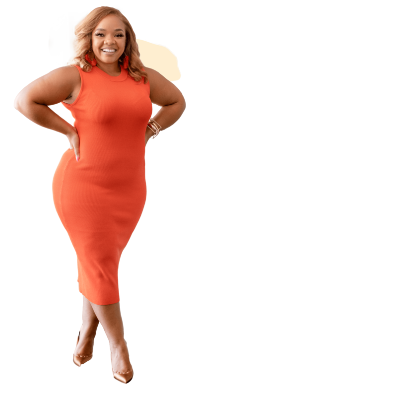 Candace Junee digital marketing coach, standing in an orange dress with hands on her hips