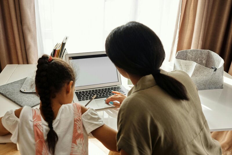 Student and teacher collaborating on homework