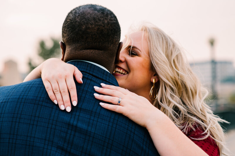 Couple hugs during engagement session in Denver, CO.