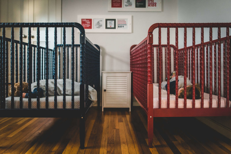 twin toddlers in crib sleeping