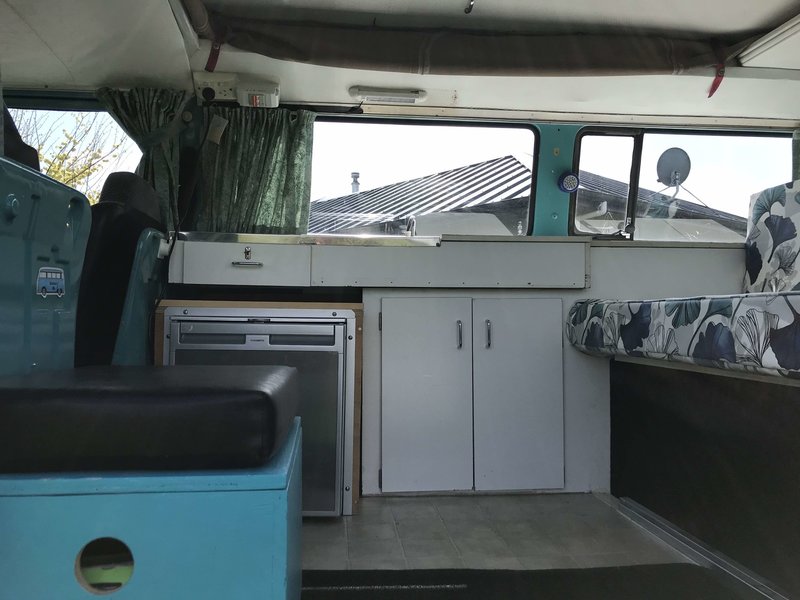 Inside  view of kitchen of Rhonda, teal retro kombi van from NZ Kombi Hire