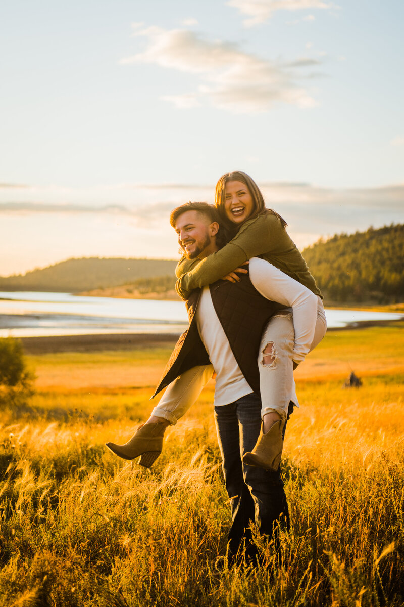 Julia Romano Photography Lake Mary gold hour piggyback ride couple Flagstaff Northern Arizona