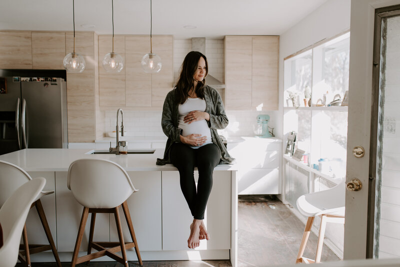 Pregnant woman in a modern home maternity session