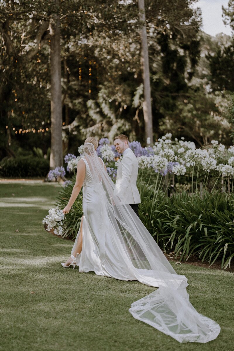 Bride + Groom talking a stroll at Gabbinbar Homestead