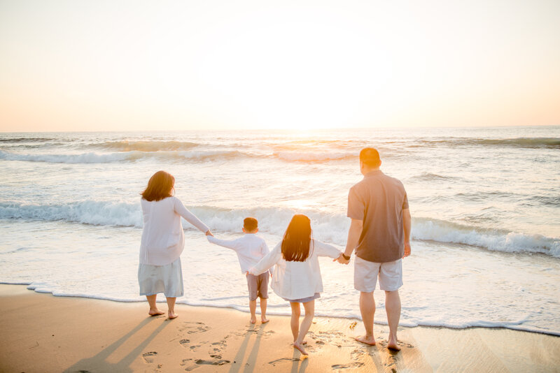 beautiful family walking at the beach in san diego enjoying their photography by Mattie Taylor Photography