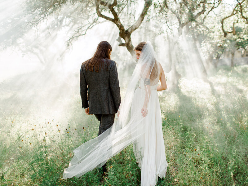 bride and groom in field kindred aura
