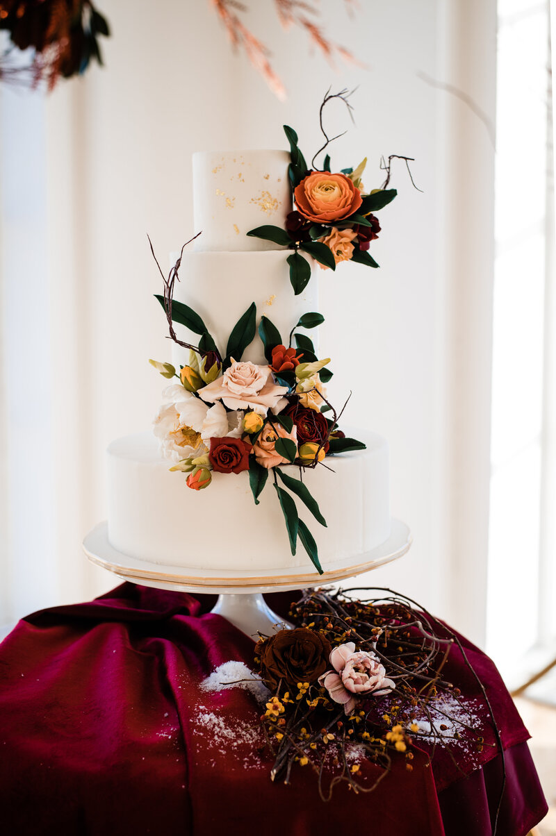 Goregous wedding cake with sugar flowers accentuated with gorgeous velvet texture