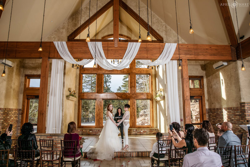 Beautiful indoor winter wedding with two brides at Della Terra Mountain Chateau