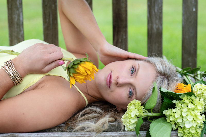 Beautiful high school senior portrait of a girl with flowers in natural light by Sharon Holy Photography