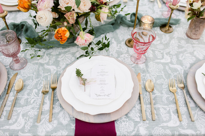 Blush and wine wedding reception flowers