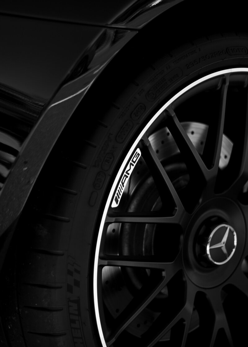 Closeup of Mercedes black rimmed tire