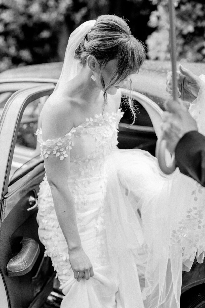 Bride leaves her wedding car on her Arundel Wedding day