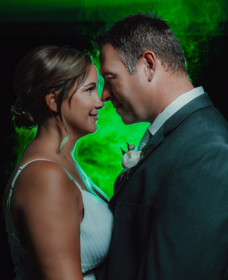 Lansing wedding with bold green gels and smoke for creative portraits. 