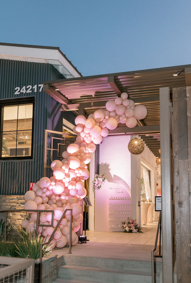 A balloon Arch decorates the entrance to Hart and Main