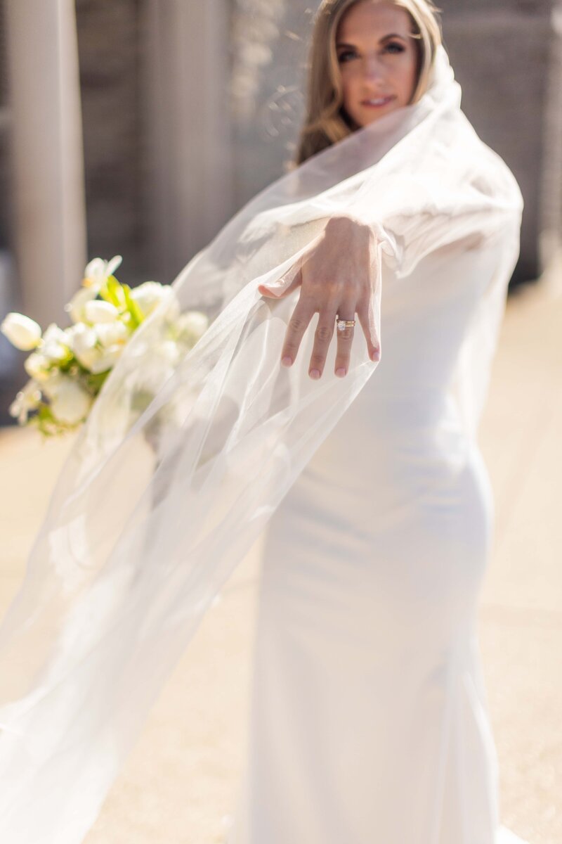 Be captivated by this timeless bridal portrait of Emily, bathed in soft, natural light. The photograph reflects the purity and joy of her wedding day, highlighting her radiant smile and the subtle details of her dress, perfect for brides looking for classic and luminous bridal inspiration.