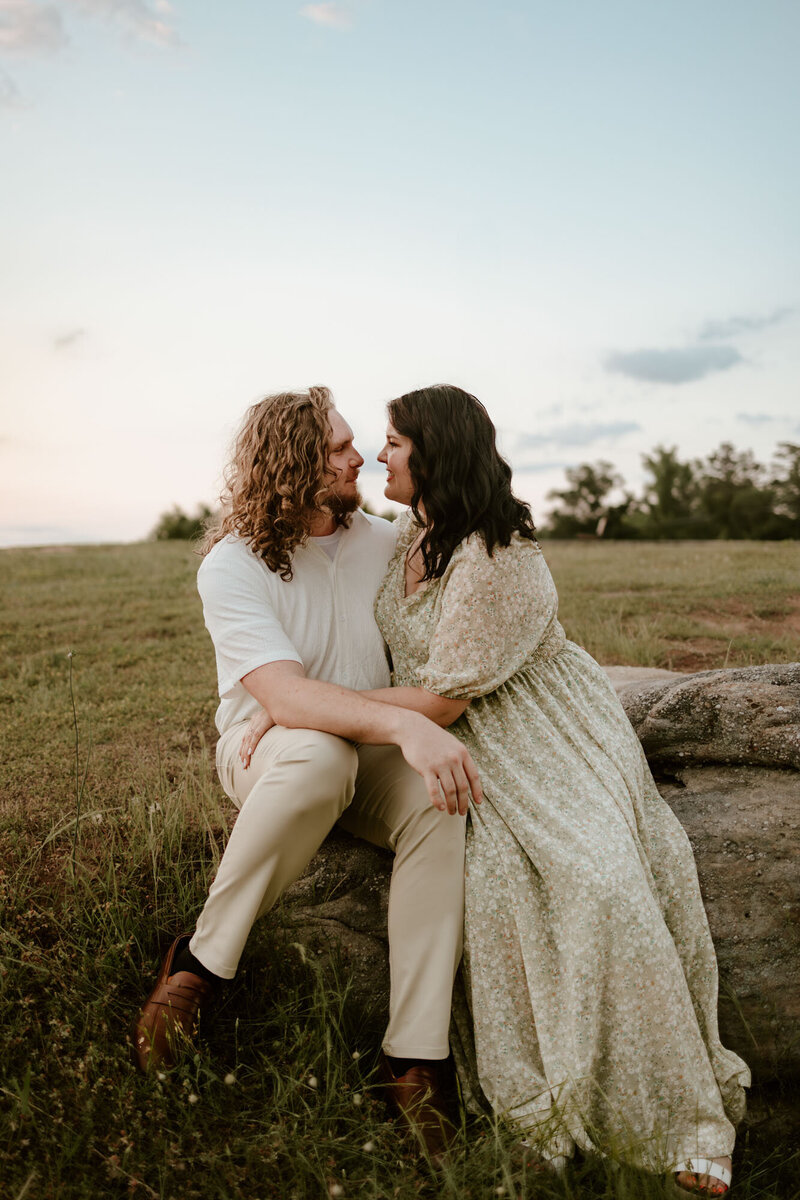 couple sitting together in grassy area