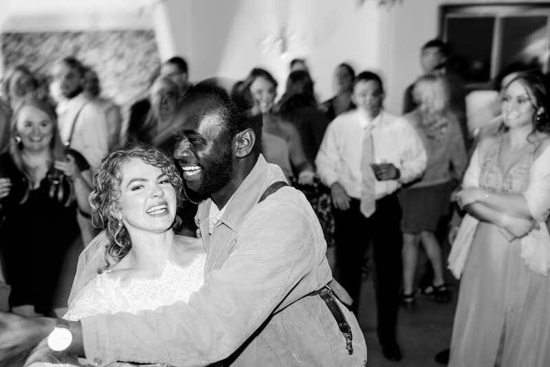 photographer dancing with bride