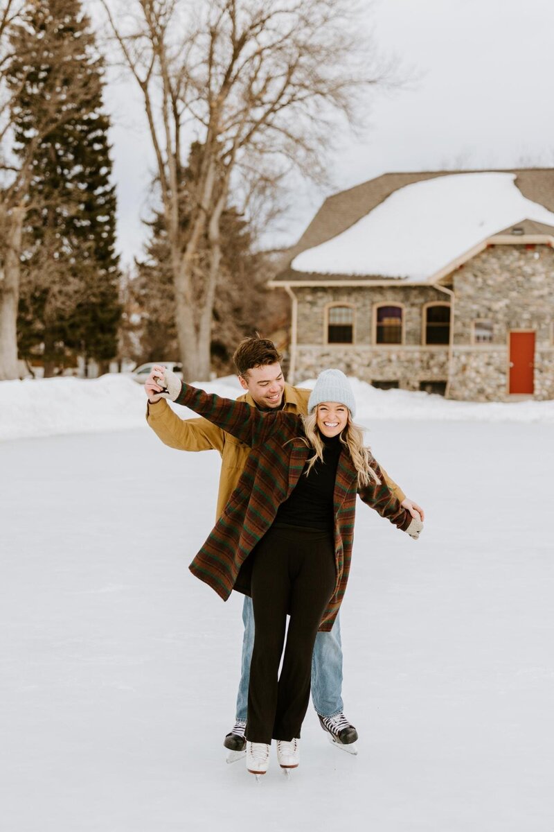 Couple poses while ice skating in Bozeman, Montana.