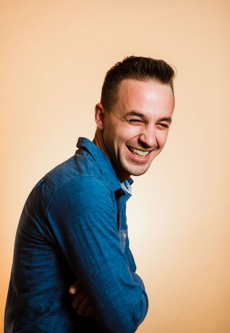 Headshot of Paul Michael Cooper wearing a denim shirt, wedding Photographer in San Diego