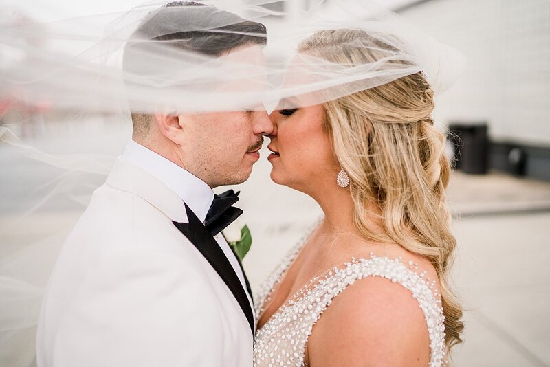 bride and groom under veil by Knoxville Wedding Photographer, Amanda May Photos