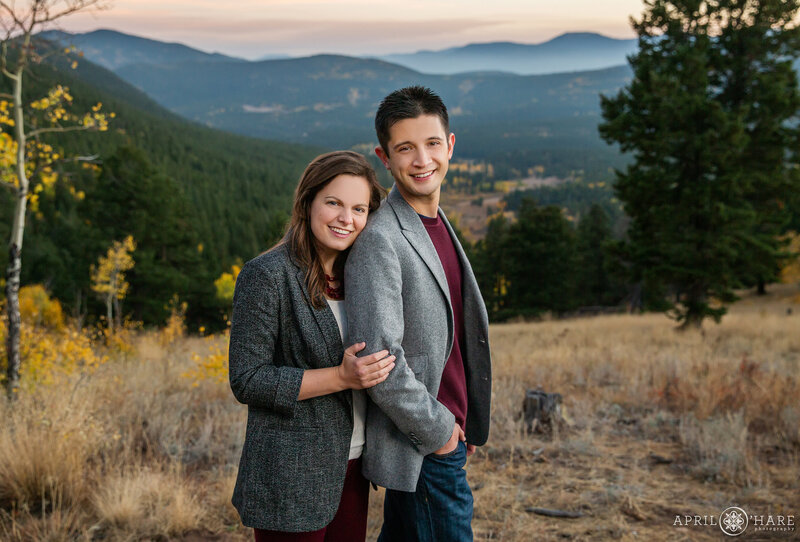 Engagement photo with pretty fall color and mountain backdrop at Golden Gate Canyon State Park
