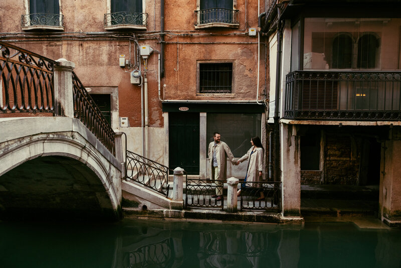 The couple strolls hand in hand through charming alleys and along serene canals, creating timeless memories against the enchanting backdrop of the city.