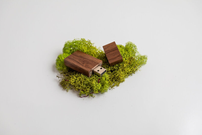 Dark Walnut Flash Drive nestled in moss. Green and brown, graduation pictures, pictures of family, graduation pictures, photographer in billings mt.