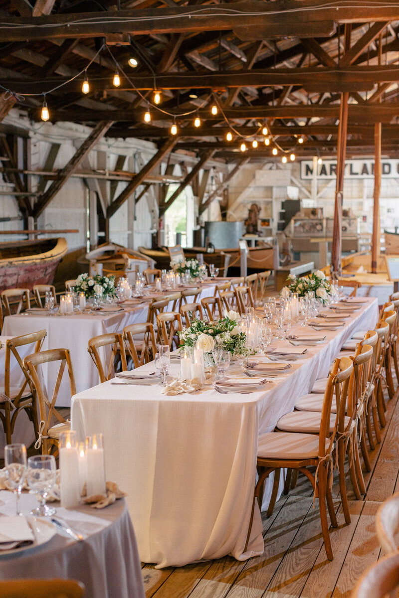 reception space indoor boat shed white and green twinkle lights