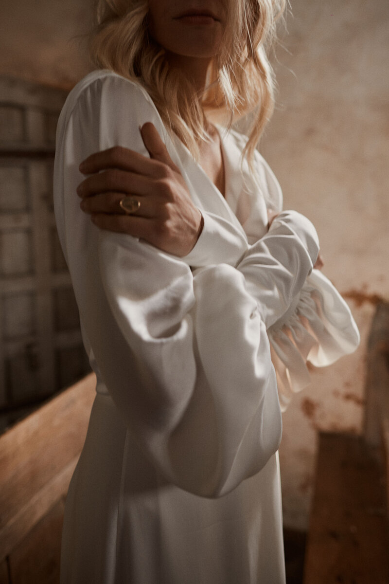 Flowing silk wedding dress with modern runched sleeves handmade by British bridal designer Luna Bea