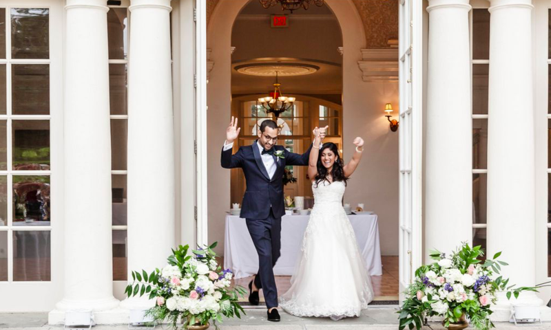 Wedding Couple Exiting Mansion in New England