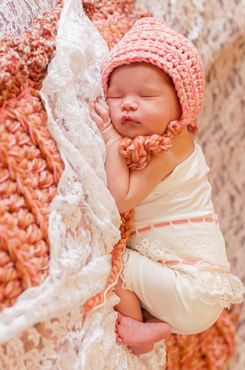 Newborn baby girl posing for photoshoot in Orange County, California