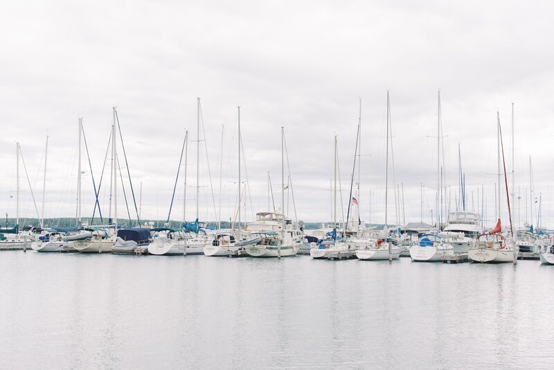 many sailboats docked at a Bayfield, WI marina on Lake Superior on an overcast day